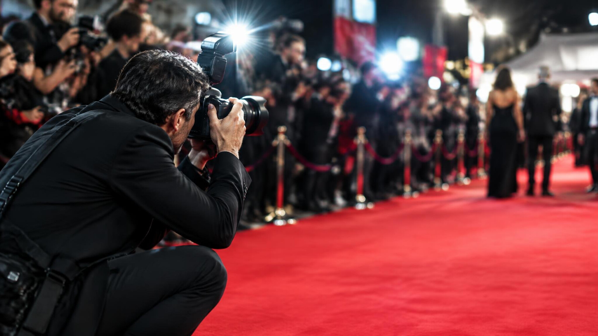 Photographer capturing a moment at a red carpet event