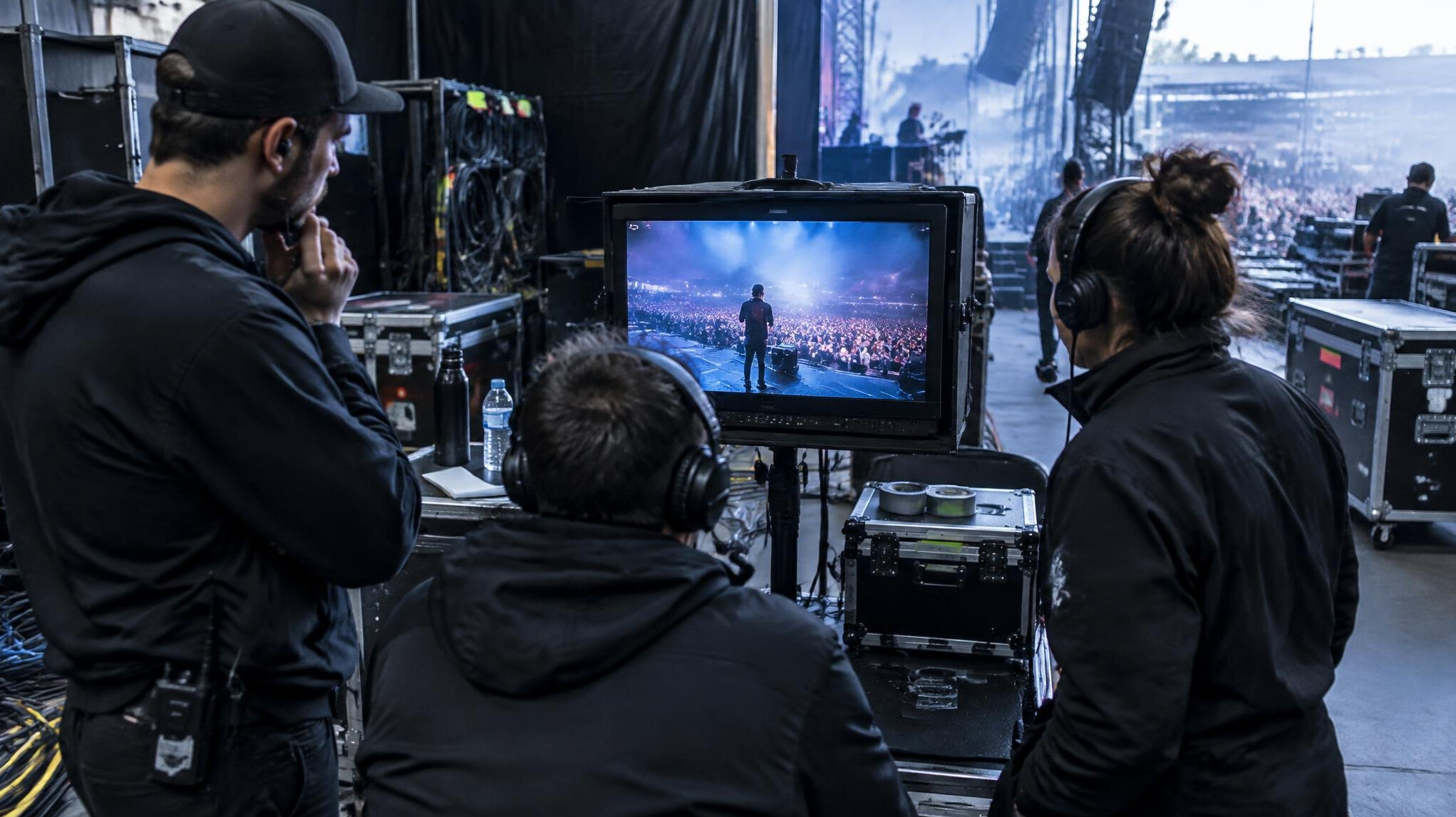 Production crew reviewing footage on a camera monitor